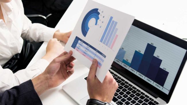 People at a laptop having a financial review People at a laptop having a financial review