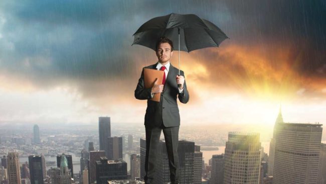 A man stood on top of a skyscraper because he has business protection A man stood on top of a skyscraper because he has business protection