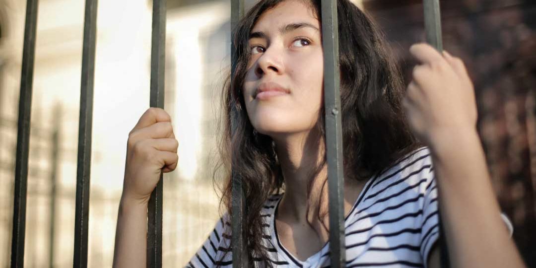 A lady behind bars as she is a mortgage prisoner A lady behind bars as she is a mortgage prisoner