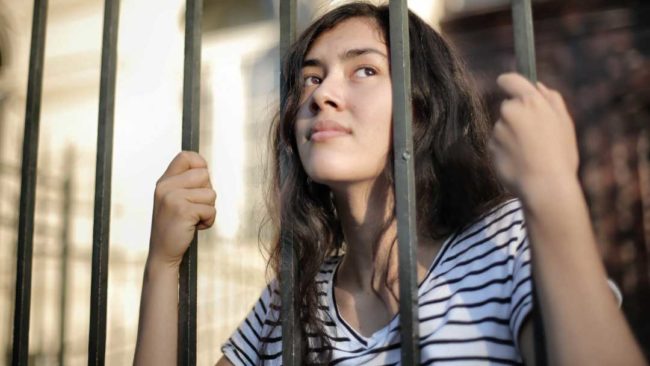 A lady behind bars as she is a mortgage prisoner A lady behind bars as she is a mortgage prisoner